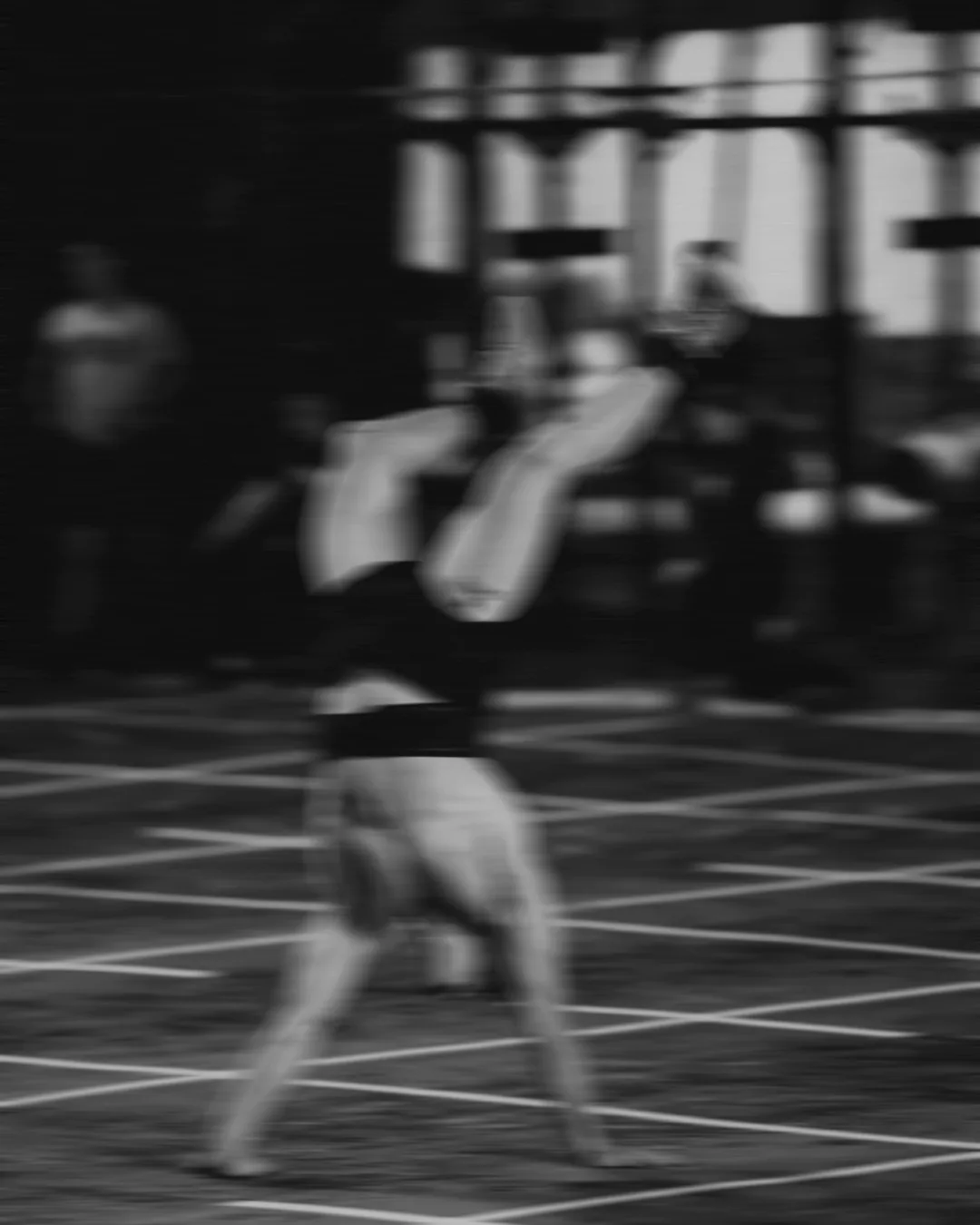 An athlete mid-rep on the competition floor